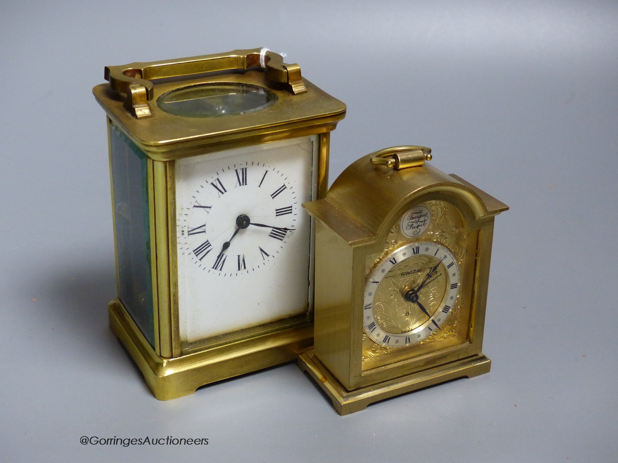 A brass carriage timepiece, 10.5cm and a carriage clock